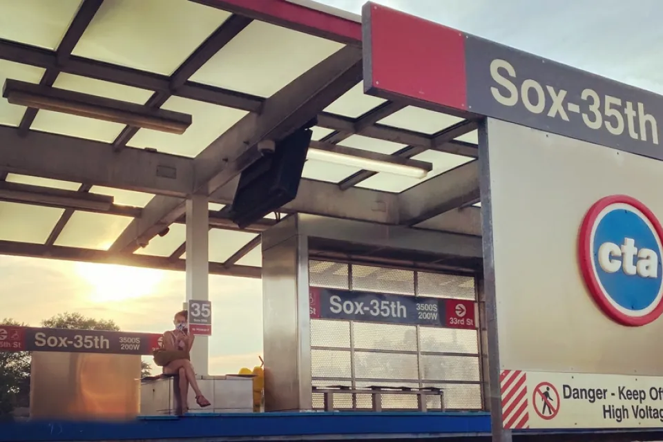 A rider waits on the platform of the Sox-35th station on the CTA Red Line in Chicago.